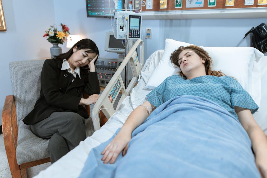 A patient and her guardian sleeping