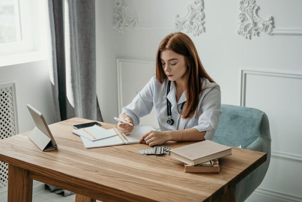 a doctor writing in a notebook