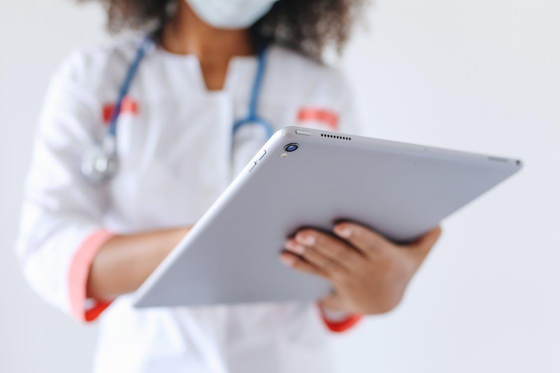 a doctor holding a tablet