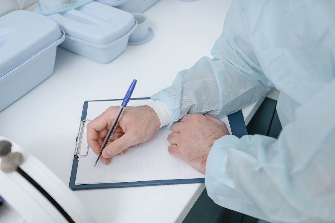 a doctor writing a medical certificate