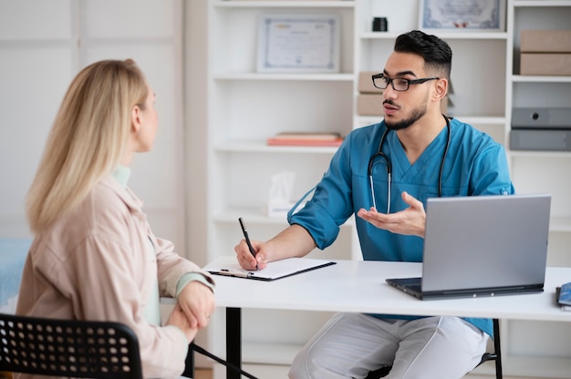 Patient consulting a doctor about symptoms of protein deficiency