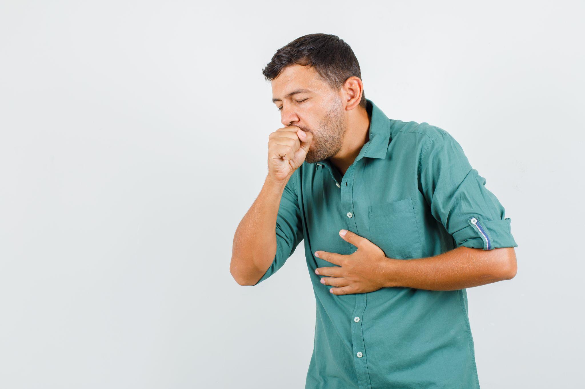 A man coughing