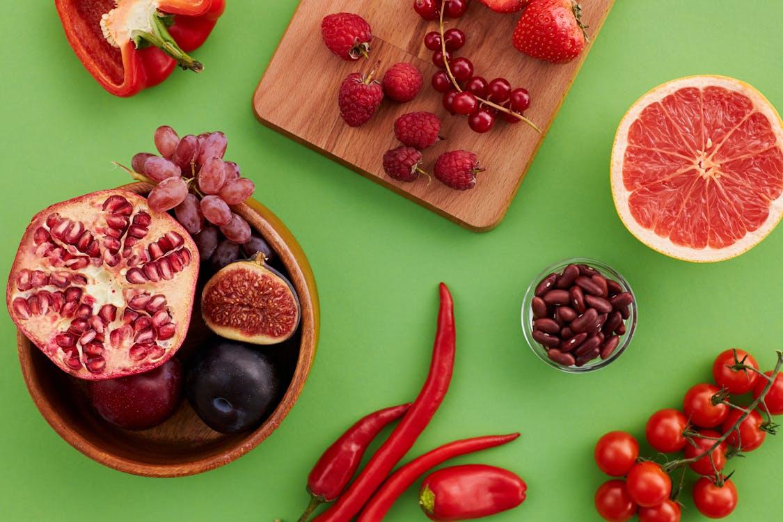 A variety of red fruits and vegetables.