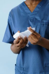 Healthcare practitioner holding sterile gauze for wound care