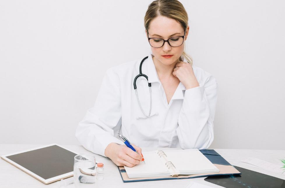 A doctor writing a sick note