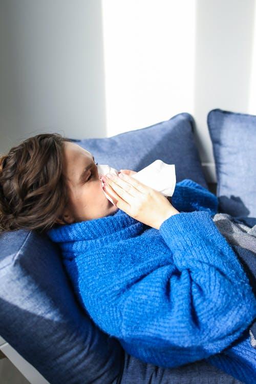 A sick woman lying down 