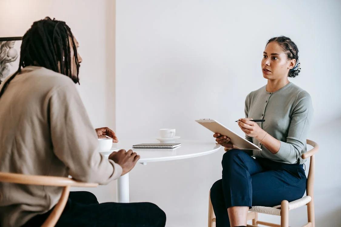 An image of an employee in a meeting with the company’s HR officer