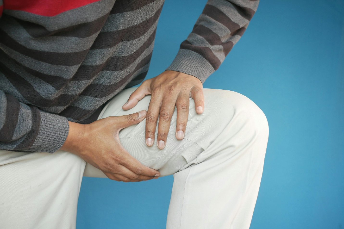 Person struggling with muscular pain