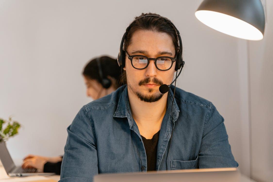 An image of an employee working in front of his laptop