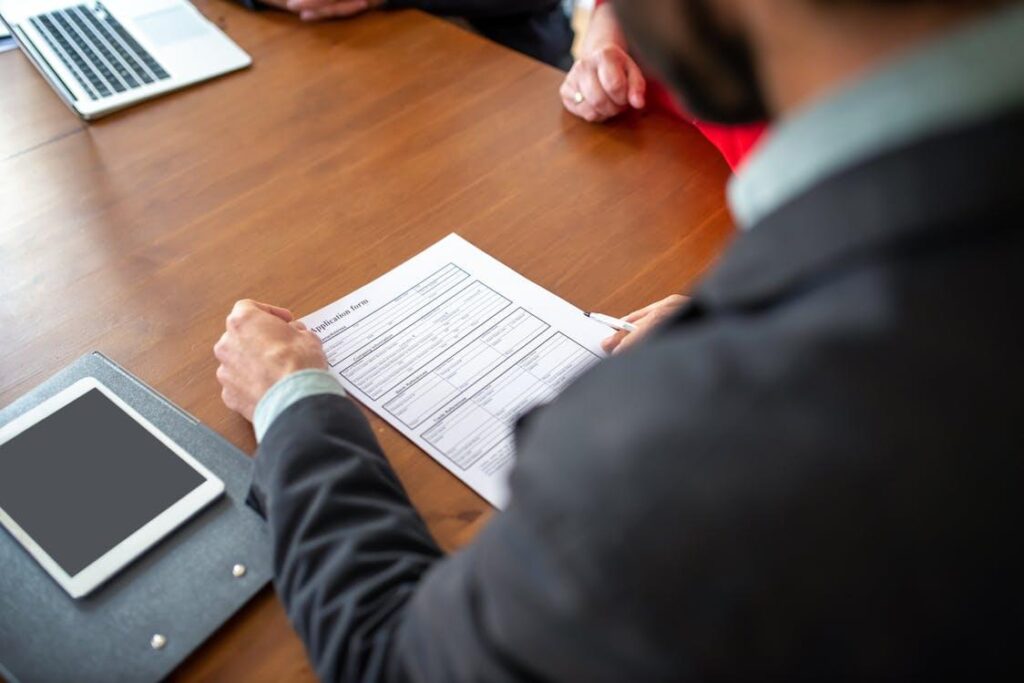 Person checking an FMLA certification form for HR approval.