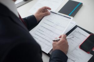 HR manager reading incomplete FMLA certification form to an employee.