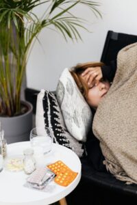 Ill woman on a sofa