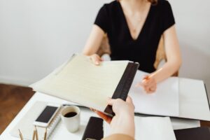 close-up of person holding documents