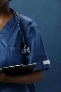 close-up of stethoscope on medical professional’s shoulder
