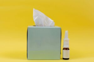 A box of tissues and a bottle