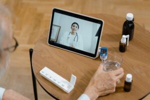 Senior patient receiving an online medical certificate for leave