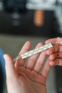 Checking temperature as part of safe fever management