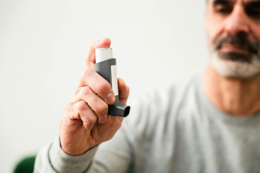 a man using an inhaler for respiratory health