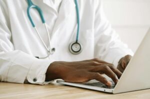 A doctor providing a medical certificate for leave.