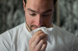 A man with allergies in need of an online doctor’s note for work.