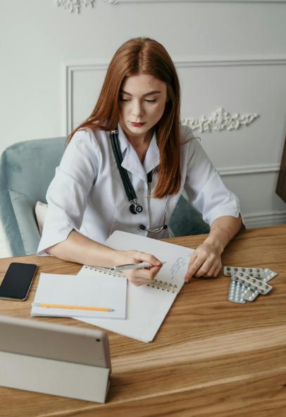 This image shows a doctor writing a medical note.