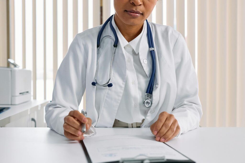a doctor writing a medical leave note