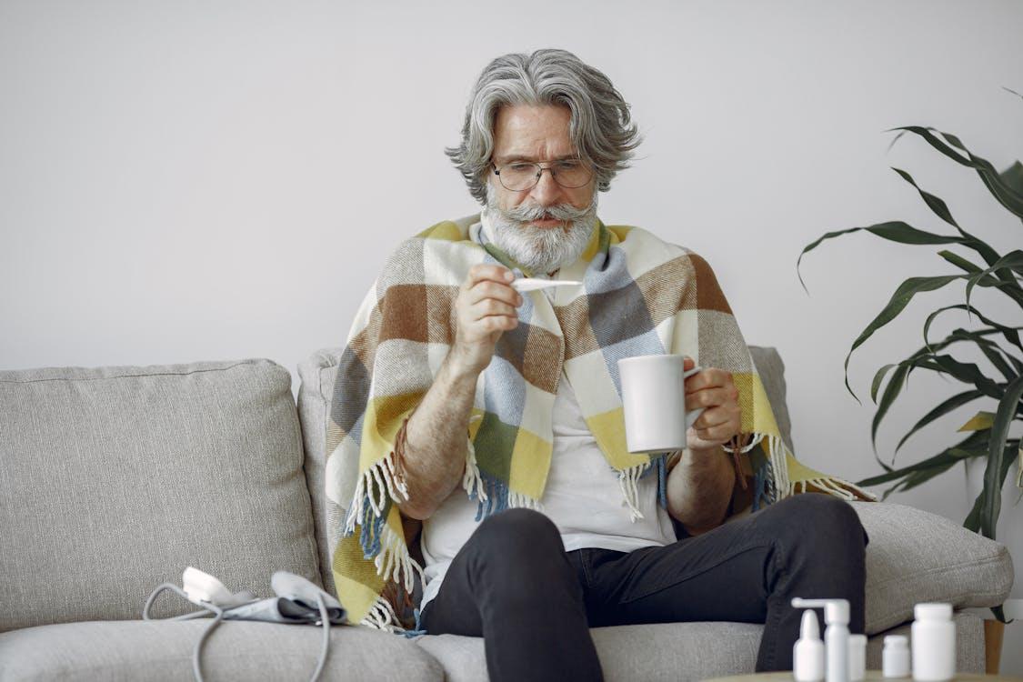 a stressed person recovering from illness, drinking tea